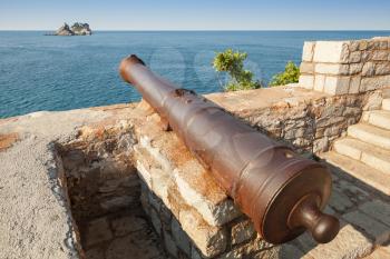 Old cannon in coastal Venetian fortress Castello. Petrovac, Montenegro
