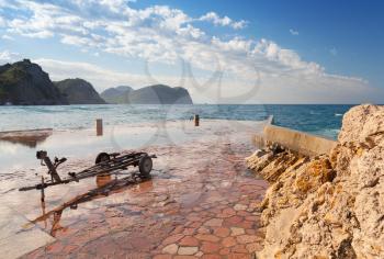 Stone breakwater and old boat trailer, Montenegro