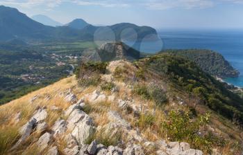 Coastal mountain landscape with dry grass on rock, Montenegro
