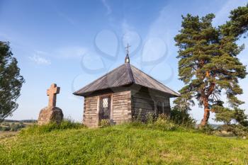 Orthodox chapel and a stone cross on Savkina gorka, Pskov Region, Russia