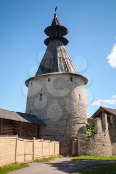 Classical Russian ancient architecture. Stone tower with wooden roofs of old fortress. Kremlin of Pskov, Russia