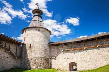 Stone tower and walls of old fortress. Kremlin of Pskov, Russia. Classical Russian ancient architecture