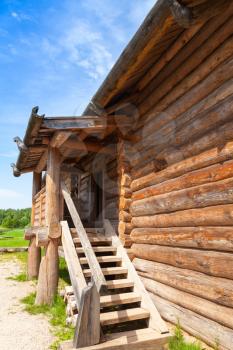 Russian rural wooden architecture example, old house fragment with stairway
