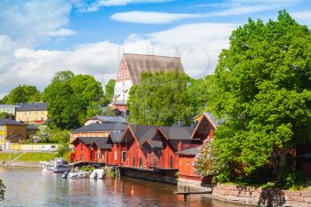Porvoo landscape. Small historical town in Finland. Old red wooden houses and trees on the coast