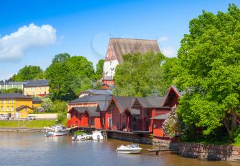 Porvoo landscape in summer. Small historical town in Finland. Old red wooden houses and trees on the coast