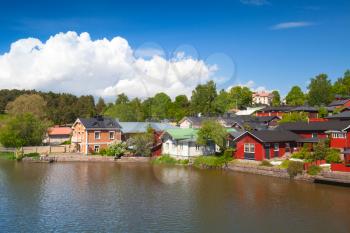 Colorful wooden houses on river coast. Porvoo, small historical town in Finland