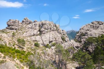 Wild mountain landscape, rocks under blue sky. South of Corsica island, France