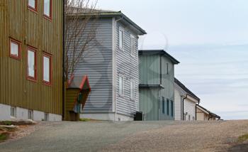 Scandinavian rural architecture. Street with colorful wooden houses