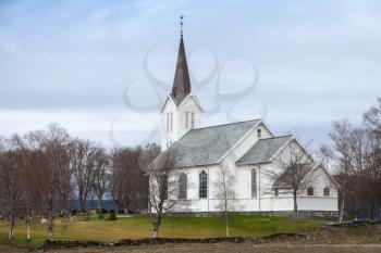 Traditional white wooden Norwegian Lutheran Church in small village