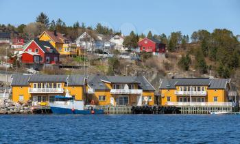 Norwegian fishing village with wooden houses on the sea coast