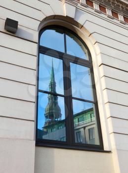 Old Cathedral is reflected in the window. Riga, Latvia