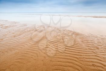 Waves on empty sandy coast of Baltic Sea