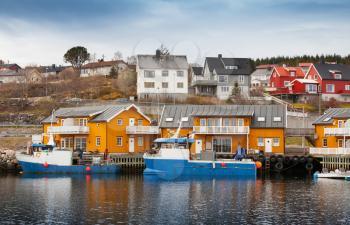 Norwegian fishing village with wooden houses on the coast