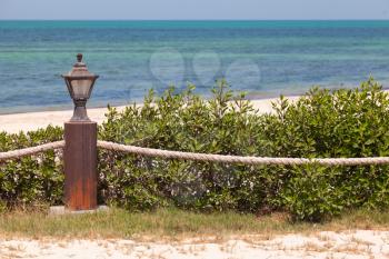 Beach border railing with rope and light