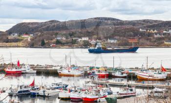 Small Norwegian village, moored fishing boats on the North sea coast 