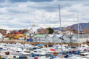 Rorvik, Norwegian fishing village landscape. Small boats are moored in marina