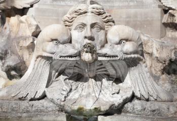 Fragment of decorative fountain with sculptures of woman and dolphins. Italy, Roma. Piazza della Rotonda. Fontana del Pantheon
