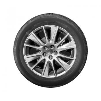 Modern crossover car wheel, front view isolated on white background