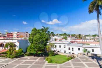 Santo Domingo,  Dominican Republic. Plaza de Espana, street view with palms and houses