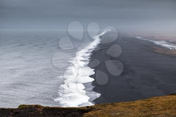 Black sands, North Atlantic Ocean coast. Dyrholaey Nature Reserve, south coast of Iceland, Europe