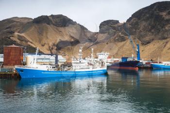 Industrial cargo ships in port of Vestmannaeyjar island, Iceland