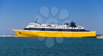 Yellow passenger ship moored in port of Zakynthos, Greek island in the Ionian Sea, popular tourist destination for summer holidays