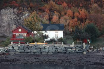 Norwegian village. Wooden houses and barns. Hasselvika is a village, municipality of Rissa in Sor-Trondelag county, Norway
