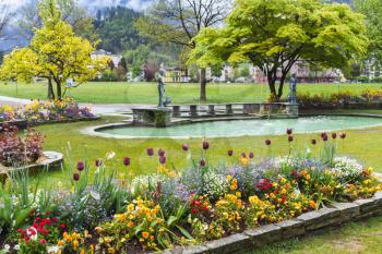 Flowers in central public park of Interlaken, Switzerland. Spring Swiss town landscape 
