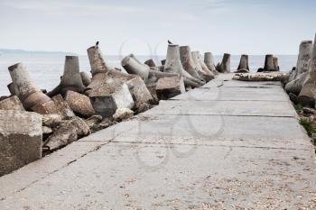 Old concrete blocks. Breakwater of Black sea coast, Bulgaria