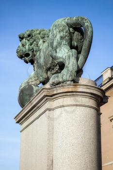 Bronze statue of the lion at Royal Palace. Old Town of Stockholm, Sweden. Rear view