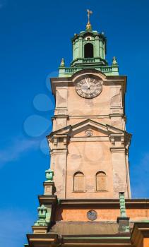 Storkyrkan, close-up photo of its tower, the oldest church in Gamla stan, the old town in central Stockholm, Sweden