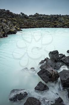 Iceland, Blue lagoon coastal landscape with rocks. This geothermal spa is one of the most visited attractions in Iceland
