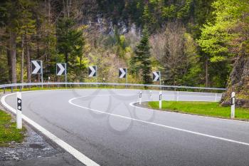 Turning mountain highway in spring season. Swiss Alps
