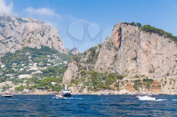Landscape with coastal rocks of Capri island near Marina Piccola beach. Mediterranean Sea, Italy