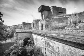 Old concrete bunker from WWII period. Totleben fort island, Gulf of Finland, Russia. Monochrome photo