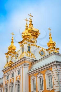 St. Petersburg, Russia - November 9, 2014: Church of Saints Peter and Paul in Peterhof, St. Petersburg, Russia. Fragment of facade with golden domes. It was build in 1747-1751 by Rastrelli architect