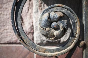 Forged fence decorative element, rusted flower in spiral, St-Petersburg, Russia