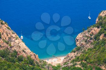 Coastal landscape of South Corsica. Small wild beach on Capo Rosso, Piana region