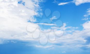 Blue sky with clouds at daytime, natural background photo