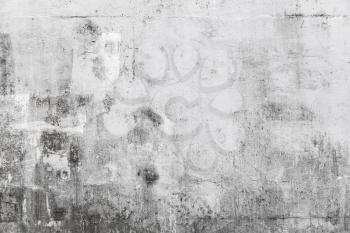 Grungy concrete wall with white paint brush strokes, background photo texture
