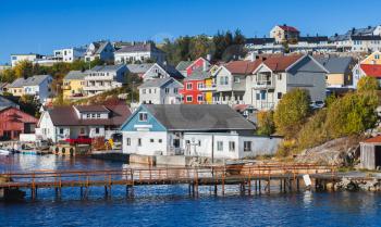 Kristiansund cityscape, coastal Norwegian town with colorful wooden houses and footbridge