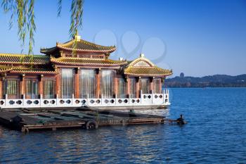Chinese floating restaurant on the West Lake coast. Famous park in Hangzhou city, China