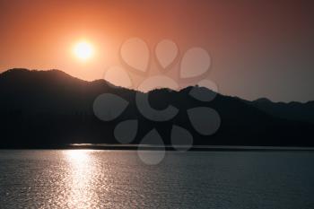 Coastal landscape of West Lake at sunset. Popular public park of Hangzhou city, China