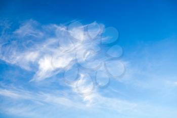 Blue sky at daytime with cirrus clouds formation. Natural background photo texture