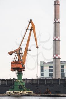 Port crane and chimney of Varna Thermal Power Plant is located on the northern shore of the Lake Varna near the village of Ezerovo, Bulgaria