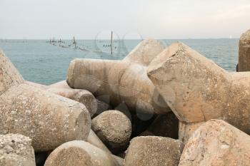 Concrete breakwater, protection wall made of massive tetrapods. Black sea coast, Varna, Bulgaria
