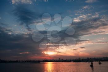 Black Sea coastal landscape, Varna port under dramatic cloudy sky at sunset