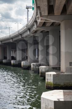 Urban concrete bridge, span bottom details, columns and beams, vertical photo