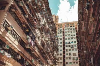 Hong Kong urban architecture background, huge block of flats walls. Vintage stylized photo with tonal correction filter