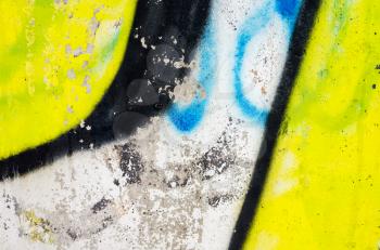 Abstract colorful graffiti fragment over old concrete wall